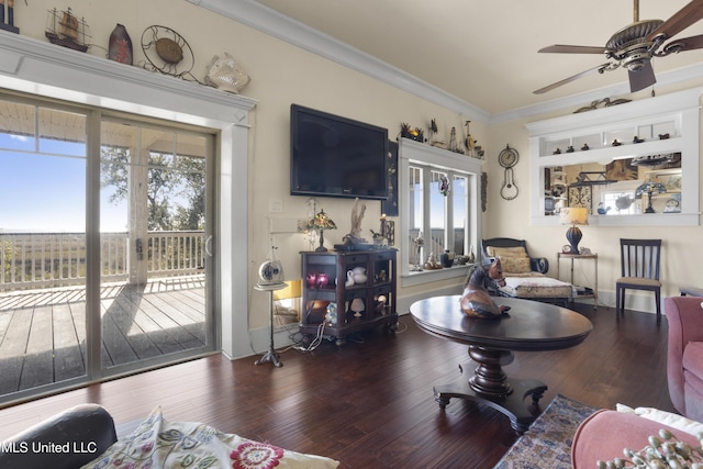 living room featuring dark hardwood / wood-style floors, ceiling fan, and ornamental molding