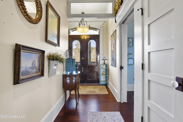 entryway with dark hardwood / wood-style flooring and french doors