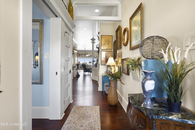 corridor featuring dark hardwood / wood-style flooring