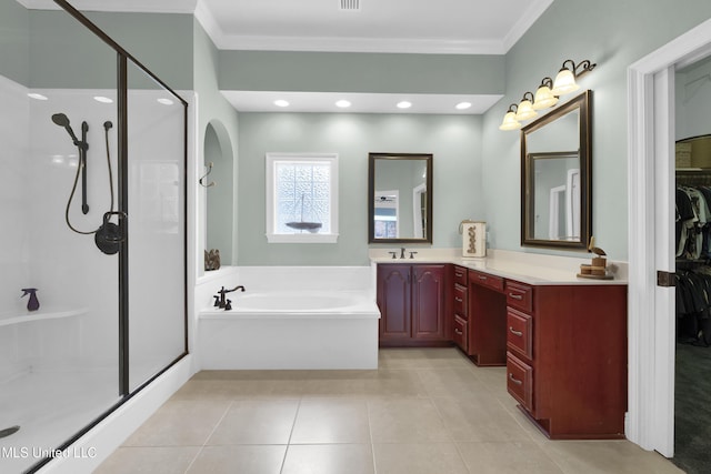 full bathroom featuring tile patterned flooring, a shower stall, a bath, and crown molding