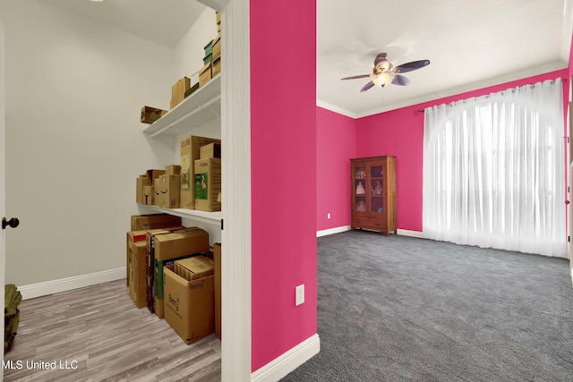 interior space featuring a ceiling fan and baseboards