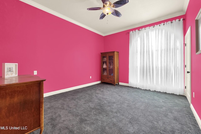 carpeted spare room featuring ceiling fan, baseboards, and ornamental molding