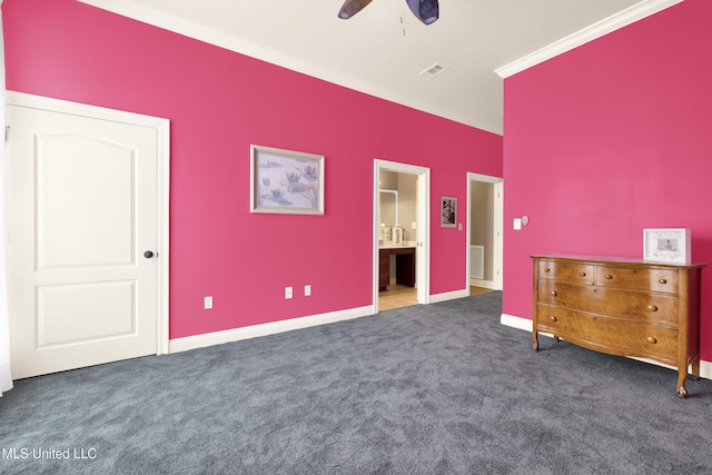 unfurnished bedroom featuring visible vents, connected bathroom, crown molding, and carpet