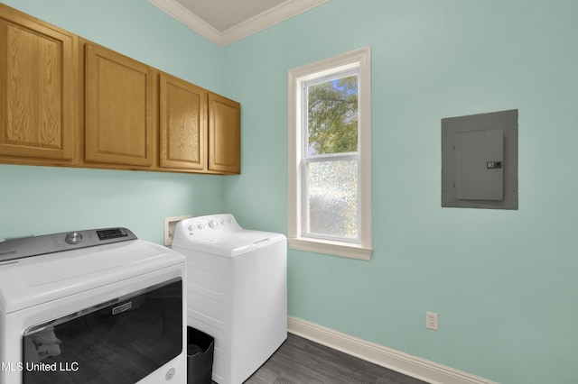 laundry area with crown molding, baseboards, washer and clothes dryer, electric panel, and cabinet space