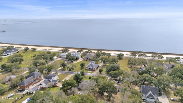 drone / aerial view featuring a water view and a residential view