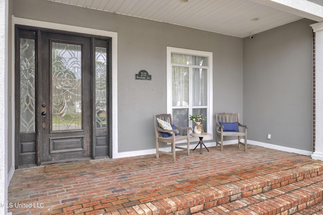 view of exterior entry with stucco siding