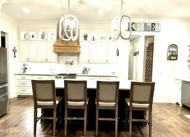 kitchen with a kitchen island and dark hardwood / wood-style flooring