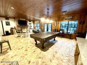 playroom featuring french doors, wood walls, and billiards