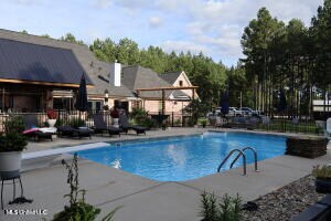 view of pool featuring a diving board