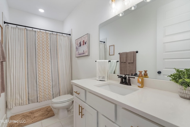 full bath with tile patterned flooring, toilet, vanity, and shower / bath combo