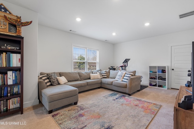 carpeted living room featuring recessed lighting, visible vents, and baseboards