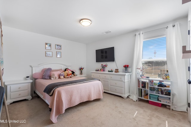 bedroom with visible vents and light colored carpet