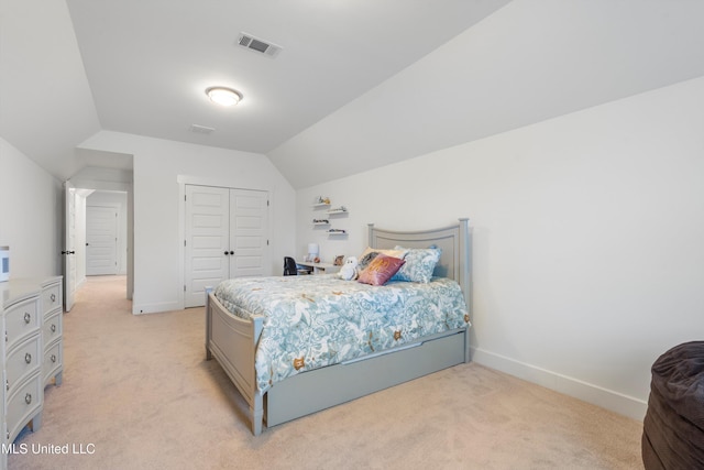 bedroom featuring visible vents, lofted ceiling, light colored carpet, and baseboards