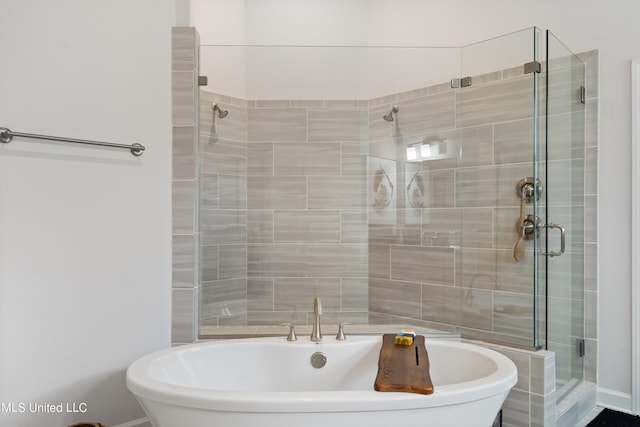 bathroom with shower with separate bathtub