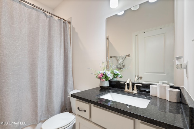 bathroom with vanity, a shower with curtain, and toilet