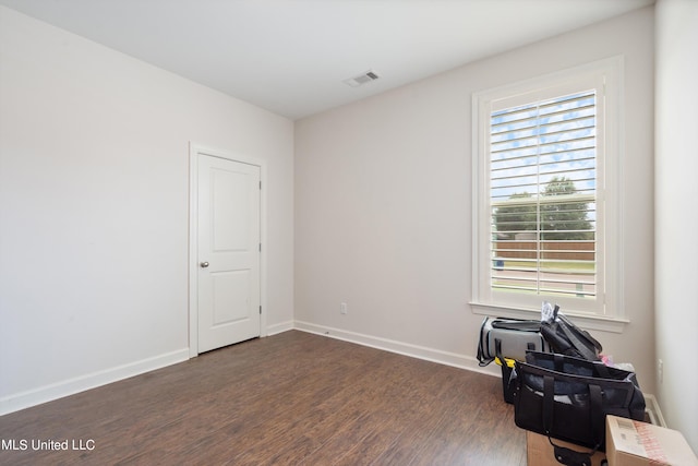 miscellaneous room featuring a wealth of natural light and dark hardwood / wood-style flooring