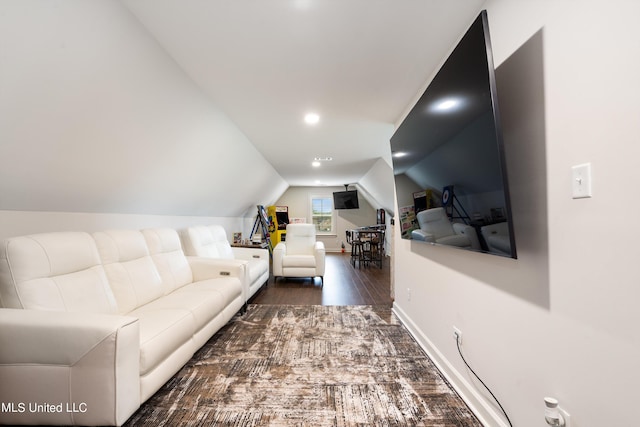 living room with lofted ceiling and dark hardwood / wood-style flooring