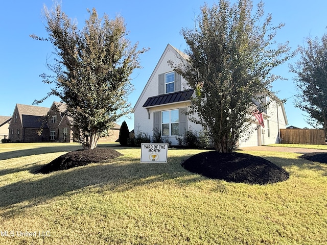 view of front of home with a front lawn