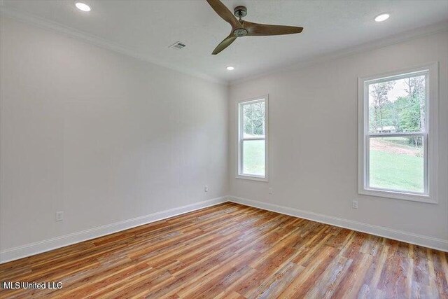 unfurnished room featuring crown molding, ceiling fan, and light hardwood / wood-style flooring