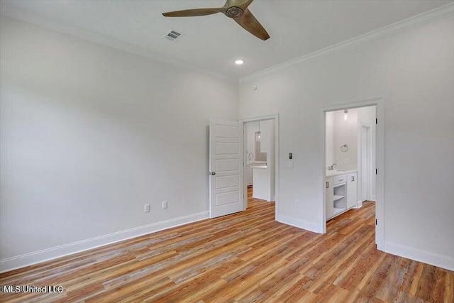 unfurnished bedroom with ceiling fan, crown molding, light hardwood / wood-style floors, and ensuite bathroom