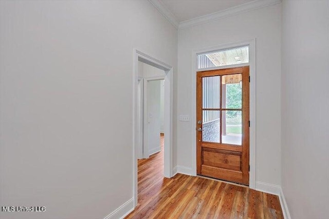 doorway with crown molding and light hardwood / wood-style flooring