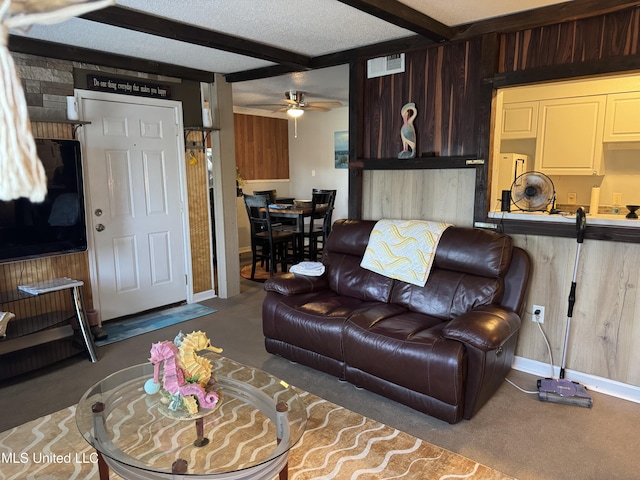 245 Mcdonnell Ave Unit 231, Biloxi, MS 39531 - carpeted living area featuring ceiling fan, baseboards, and beam ceiling