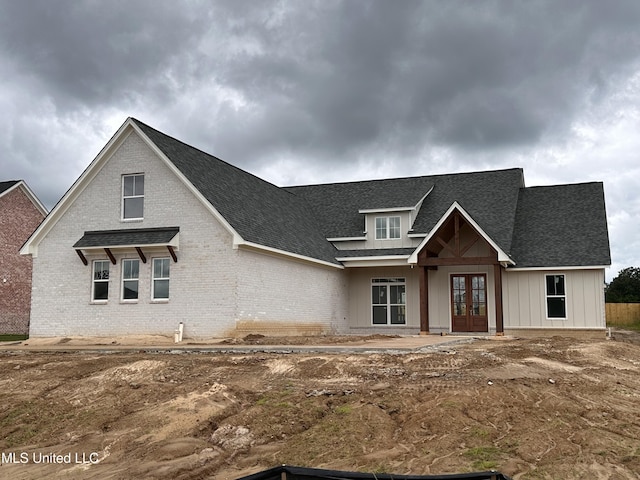 1805 Bakersfield Way, Nesbit, MS 38651 - view of front of house featuring french doors, brick siding, and a shingled roof