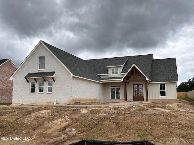 1805 Bakersfield Way, Nesbit, MS 38651 - view of front of house with french doors, brick siding, and a shingled roof