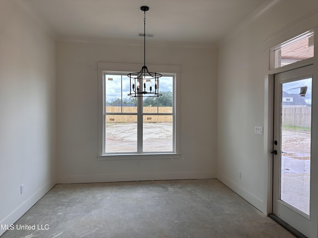 1805 Bakersfield Way, Nesbit, MS 38651 - unfurnished dining area with healthy amount of natural light, concrete floors, ornamental molding, and a chandelier