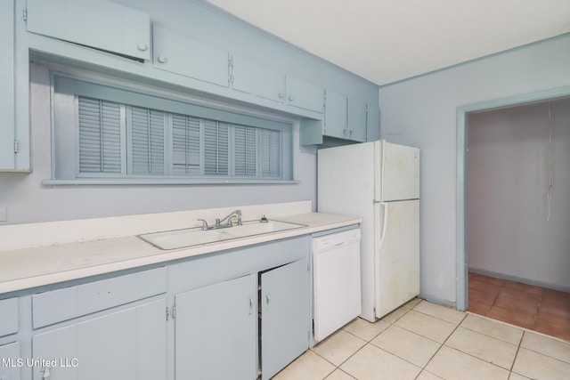 3008 Papania Ln, Gulfport, MS 39501 - kitchen with white appliances, a sink, light countertops, and light tile patterned floors