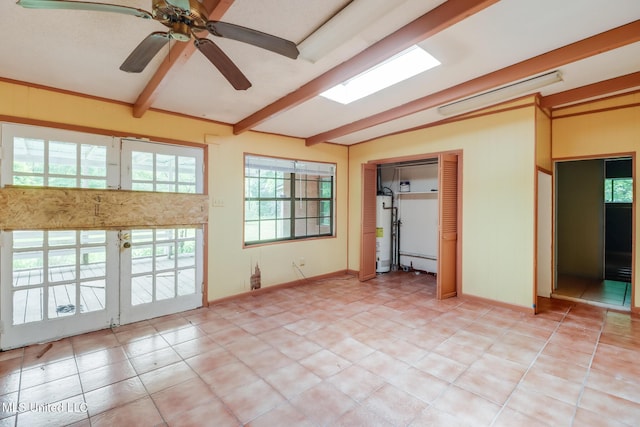 3008 Papania Ln, Gulfport, MS 39501 - empty room with plenty of natural light, gas water heater, ceiling fan, and light tile patterned flooring