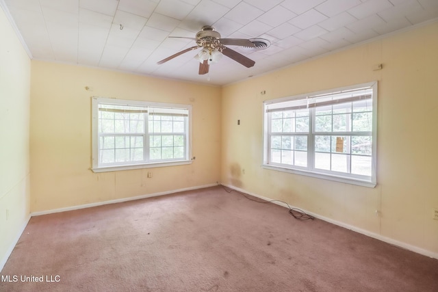 3008 Papania Ln, Gulfport, MS 39501 - carpeted spare room with plenty of natural light, a ceiling fan, baseboards, and ornamental molding