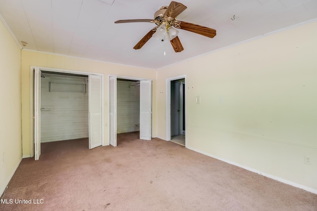 3008 Papania Ln, Gulfport, MS 39501 - unfurnished bedroom featuring carpet, two closets, and baseboards