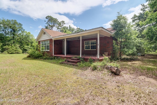 3008 Papania Ln, Gulfport, MS 39501 - view of side of property with brick siding and a yard