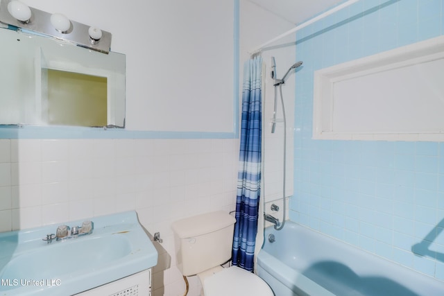 3008 Papania Ln, Gulfport, MS 39501 - full bathroom featuring toilet, shower / bath combination with curtain, tile walls, and vanity