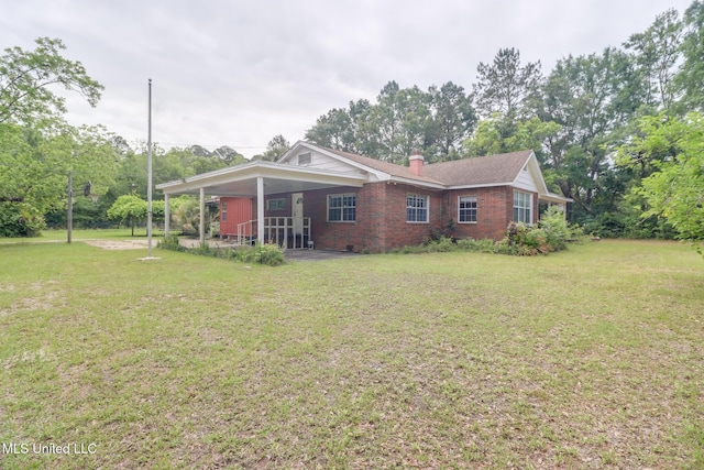 3008 Papania Ln, Gulfport, MS 39501 - view of side of home with brick siding, a lawn, and a chimney