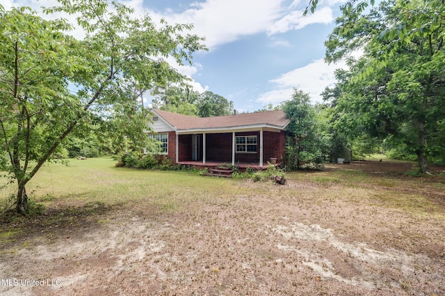 3008 Papania Ln, Gulfport, MS 39501 - back of property featuring brick siding and a lawn