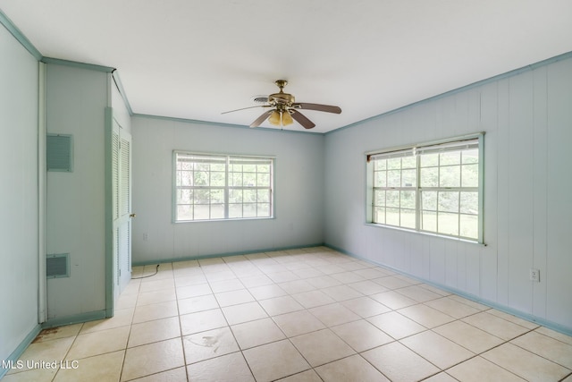 3008 Papania Ln, Gulfport, MS 39501 - unfurnished room featuring ceiling fan, ornamental molding, and light tile patterned floors