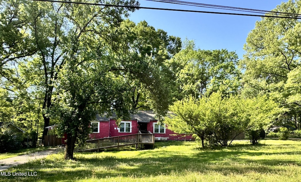 view of yard with a wooden deck