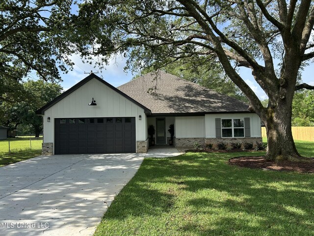 3076 Highland Ave, Diberville, MS 39540 - view of front of home with roof with shingles, a garage, concrete driveway, and brick siding