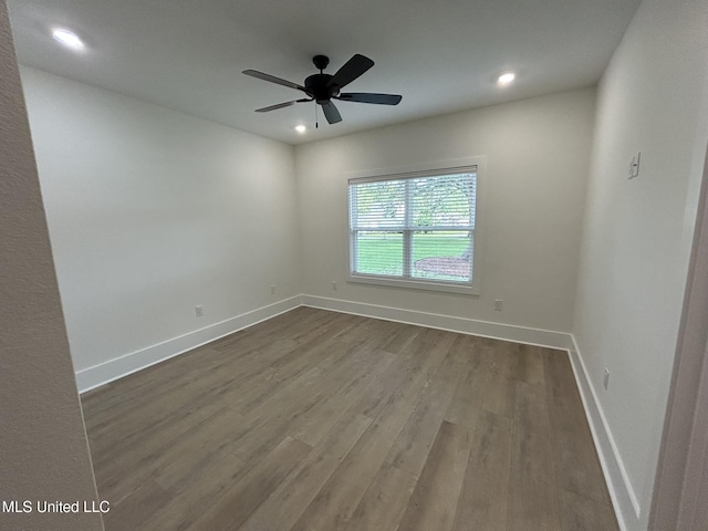 3076 Highland Ave, Diberville, MS 39540 - spare room featuring dark wood finished floors, baseboards, recessed lighting, and a ceiling fan