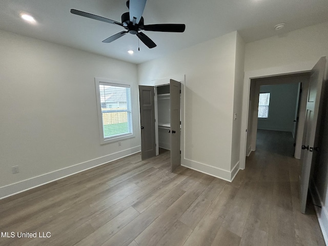 3076 Highland Ave, Diberville, MS 39540 - unfurnished bedroom with baseboards, wood finished floors, a ceiling fan, and recessed lighting