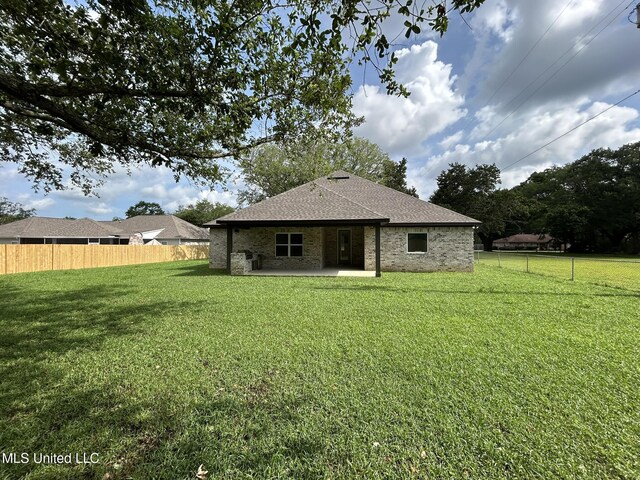 3076 Highland Ave, Diberville, MS 39540 - rear view of property featuring a patio and roof with shingles