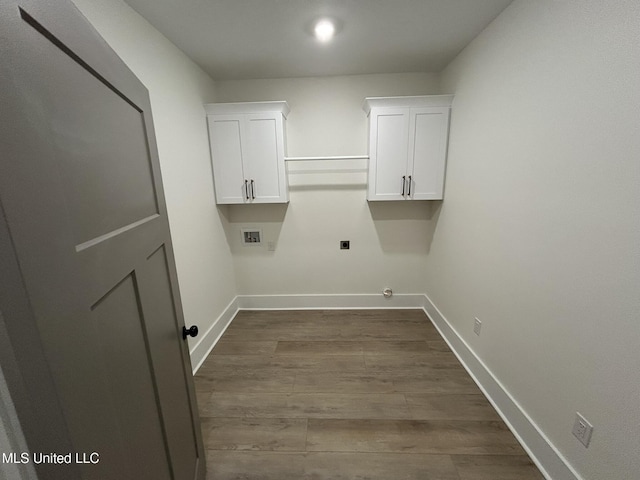 3076 Highland Ave, Diberville, MS 39540 - washroom featuring hookup for a washing machine, hookup for an electric dryer, baseboards, and dark wood-style flooring