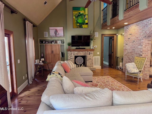236 Sawbridge Dr, Ridgeland, MS 39157 - living area featuring high vaulted ceiling, a brick fireplace, baseboards, wood finished floors, and ceiling fan