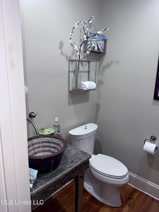 236 Sawbridge Dr, Ridgeland, MS 39157 - bathroom featuring toilet, wood finished floors, baseboards, and vanity