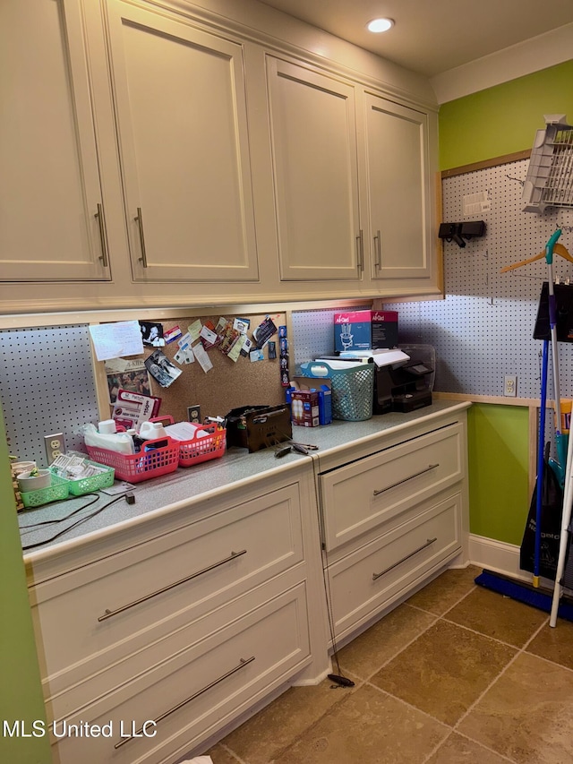 236 Sawbridge Dr, Ridgeland, MS 39157 - kitchen with light countertops, white cabinets, and tile patterned floors