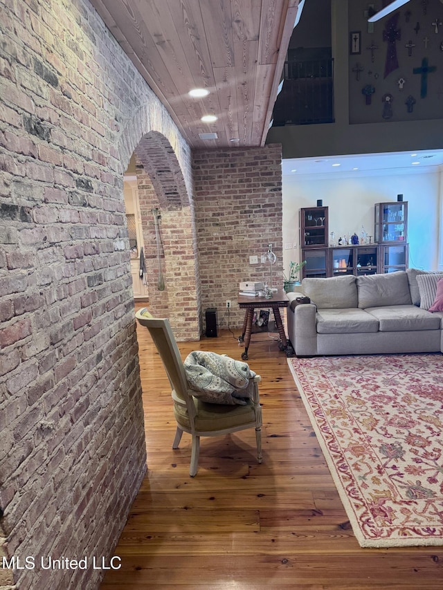 236 Sawbridge Dr, Ridgeland, MS 39157 - living room with wood-type flooring, wood ceiling, brick wall, and arched walkways