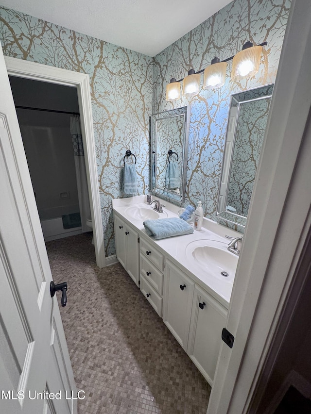236 Sawbridge Dr, Ridgeland, MS 39157 - full bathroom featuring wallpapered walls, double vanity, toilet, and a shower with shower curtain