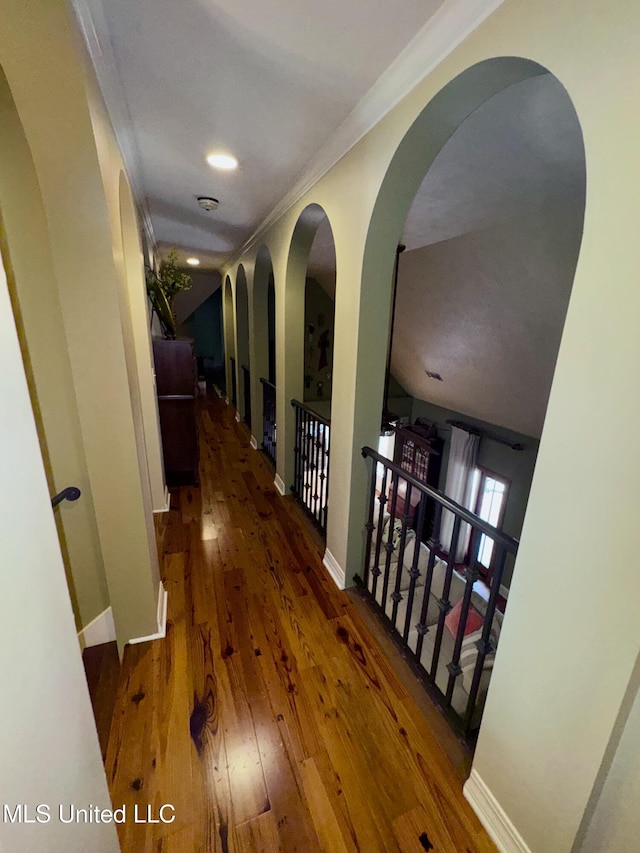 236 Sawbridge Dr, Ridgeland, MS 39157 - corridor with baseboards, hardwood / wood-style flooring, ornamental molding, arched walkways, and recessed lighting
